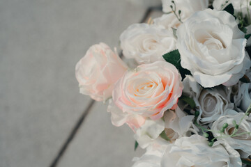 Elegant Arrangement of Soft Pink and White Roses on a Neutral Background Perfect for Floral Decorations and Events