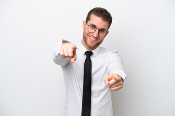 Young business caucasian man isolated on white background points finger at you while smiling