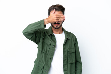 Young caucasian man isolated on white background covering eyes by hands. Do not want to see something