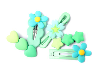 Many cute hair clips isolated on white, top view