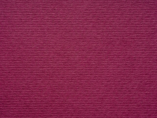 Bathed in burgundy, this paper's texture suggests a blend of luxury, mystery, and the allure of the unknown