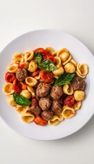 Elegantly presented orecchiette with beef polpette on a white background showcasing vibrant colors