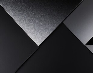 Abstract geometric design featuring varying shades of black and silver textures.