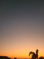 The moon and star at sunset.