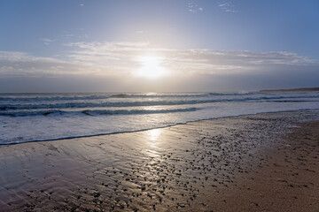 Early morning sunrise Burnett Heads Beach Queensland, atmospheric light rays and ocean waves, summer holiday vacation Australia travel