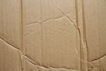 Old brown cardboard texture background with wrinkles and folds
