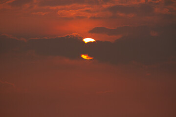 The sun is behind the clouds in the morning. Morning atmosphere.