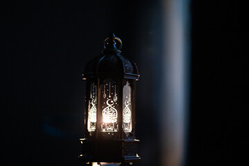 ornamental Arabic lantern Ramadan and Eid al-Fitr greeting card. The arabic calligraphy translation...