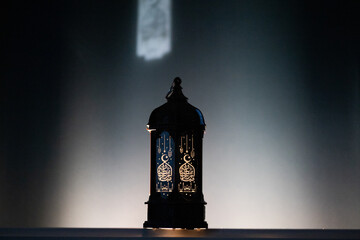 ornamental Arabic lantern Ramadan and Eid al-Fitr greeting card. The arabic calligraphy translation...