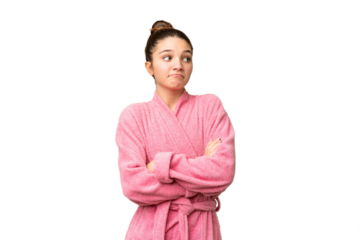 Teenager girl in a bathrobe over isolated chroma key background making doubts gesture while lifting the shoulders