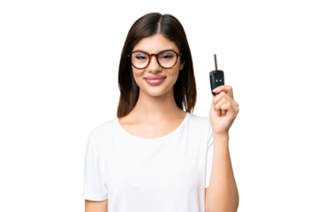 Young Russian woman holding car keys over isolated chroma key background smiling a lot