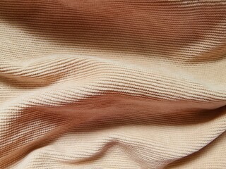 Close up beige cotton fabric with wrinkle background. Corduroy Small Groove texture 