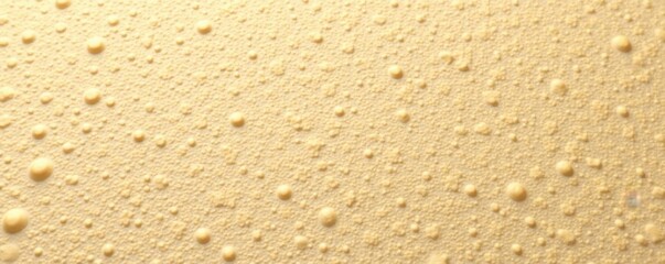 Close-up of a beige rubber surface showing fine pores , pores, industrial