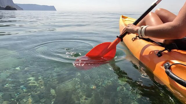 Kayaking, Paddle, Water - A person kayaking on the water with a paddle in hand.