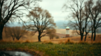 Abstract blur of a wet road surrounded by trees with a gloomy atmosphere, perfect for moody or introspective themes.