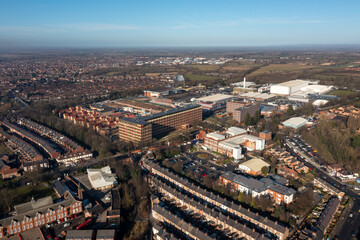 Fototapeta premium Aerial drone photo of the city of York in North Yorkshire, England showing the large Nestle chocolate factory in the city showing the large building surrounded by houses and homes in the winter time