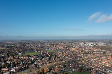 Aerial drone photo of the city of York in North Yorkshire England showing a birds eye view of the British town and rows of houses and large suburban housing estates taken in the winter time