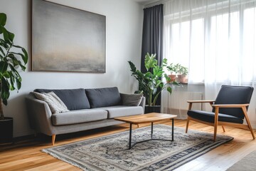 Modern living room with sofa, armchair, plants, and rug.