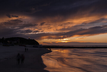 SEA COAST - A picturesque sunset over the sea shore
