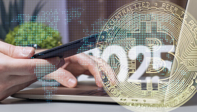 Hands Using Smartphone and Laptop with Overlay of Bitcoin Cryptocurrency Symbol, Digital World Map, and Blockchain Technology Concept - Powered by Adobe