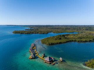 Aerial shot of luxury hotel and water bungalow in the Caribbean sea, Bocas del Toro island, Panama - stock photo
