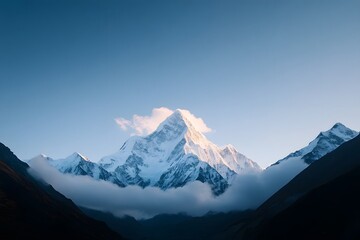 Majestic Snow Capped Mountain Peaks at Serene Sunrise in Epic Wilderness Landscape