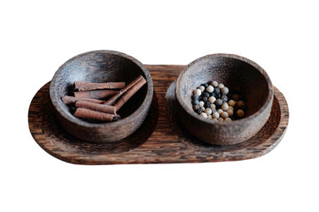 Tradition aromatic and herbal ingredients in coconut shells on rustic wooden plate decorated in tropical resort of Asian