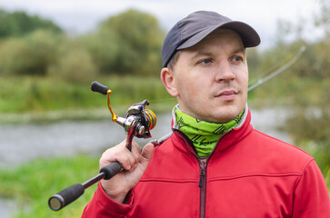 Portrait of Fisherman on the river bank.