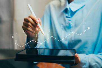 Business Growth Concept with Graph, Tablet, and Hand Holding Stylus for Financial Analysis,...