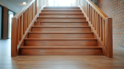 Wooden staircase with warm lighting leading to the upper floor symbolizing progress ambition career growth and steps towards success in a business setting