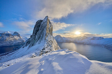 icy winter landscape of the snowy Segla summit near Fjordgard, the most famous mountain  on Senja...