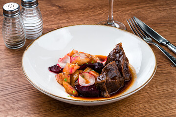 tender beef cheek with new potatoes