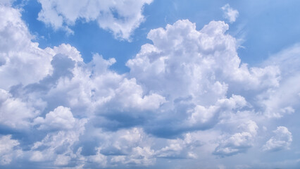 Summer clouds in blue sky in daylight