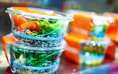 Pre-packaged meals displayed in a commercial refrigerator