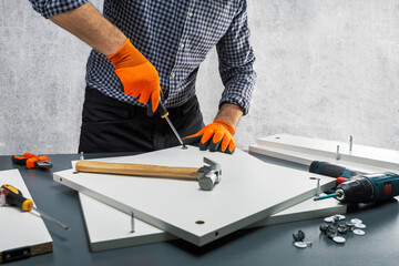 Man assembling a bookshelf.