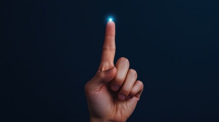 A minimalist digital depicting a single hand with a finger pointing upward surrounded by a soft glowing blue light against a dark background  The image conveys a sense of direction potential