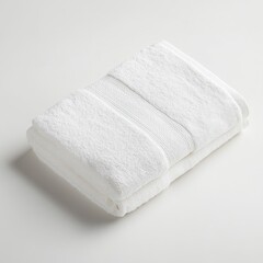 Neatly Folded White Terrycloth Towel in a Stack on Plain Background for Bath and Spa Use
