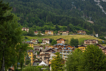 Beautiful traditional summer view in Molveno, Trentino Alto Adige, Italy, scenic village, lake, and mountain landscape