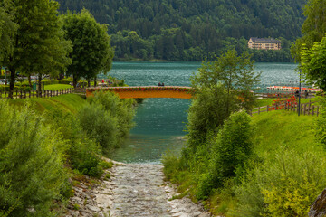 Fototapeta premium Beautiful traditional summer view in Molveno, Trentino Alto Adige, Italy, scenic village, lake, and mountain landscape