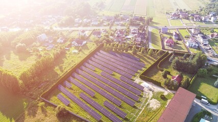 Aerial view solar panels near large industrial building