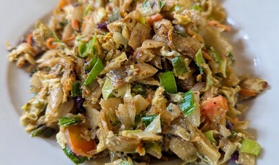 Closeup of kottu popular Sri Lankan cuisine food stir fry with chopped roti and vegetables served at restaurant