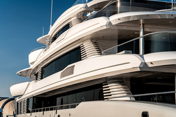 Architectural and nautical design detail of a large superyacht at dock in Genova, Italy