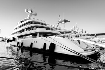 Obraz premium Black and White image of large superyacht or megayach located in Genova, Italy after shipyard maintenance 