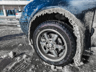 Icicles Are Forming under a Car wheel arch Harsh Winter Conditions and Cold Environments