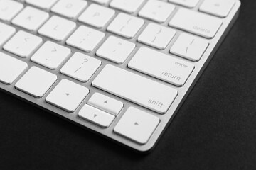 Technical support concept. Modern keyboard on black background, closeup