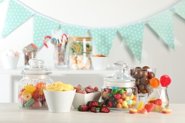 Candy bar. Many different sweets on white table indoors
