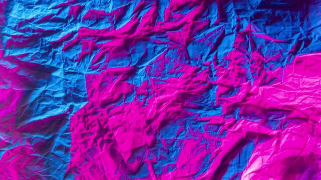 Crumpled colourful pink blue lights paper stop motion animation Crumpled paper sheet texture with a stop motion effect, seamless loop. Animation. Abstract creased paper, concept of art Background