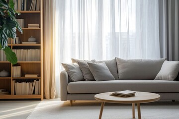 Fototapeta premium Sunlit living room with beige sofa, wooden coffee table, bookshelves, and sheer curtains.