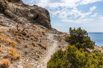 Rocks on the Golitsyn Trail is a mountain path cut into the slope of Mount Koba-Kaya, located along...