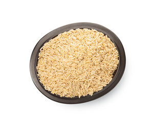 Raw brown rice in bowl isolated on white, top view